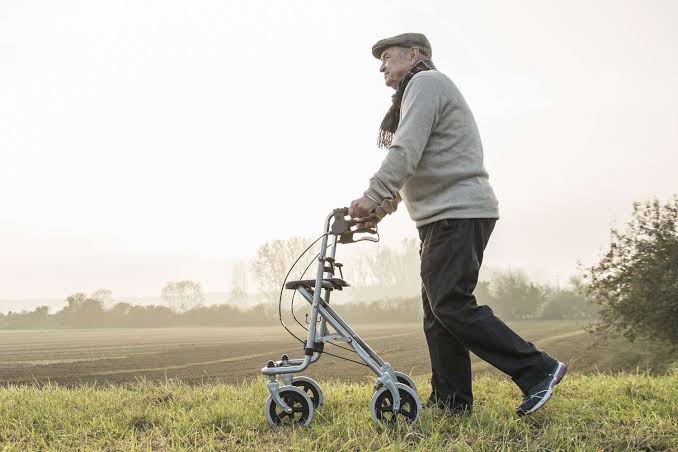 Older adult using a mobility walker